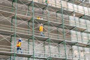 Construction Workers Navigating Scaffolding